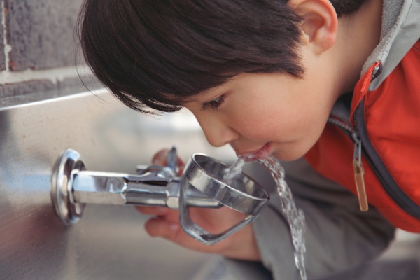 Child drinking water in school